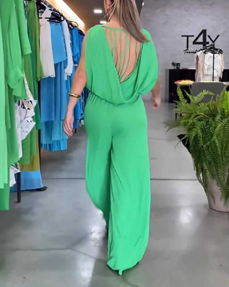 Solid color sleeveless jumpsuit with tassels on the back